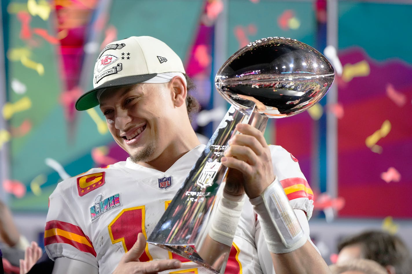 Kansas City Chiefs quarterback Patrick Mahomes (15) holds the trophy after their win against the Philadelphia Eagles in the NFL Super Bowl 57 football game, Sunday, Feb. 12, 2023, in Glendale, Ariz. The Kansas City Chiefs defeated the Philadelphia Eagles 38-35. (AP Photo/Matt Slocum)