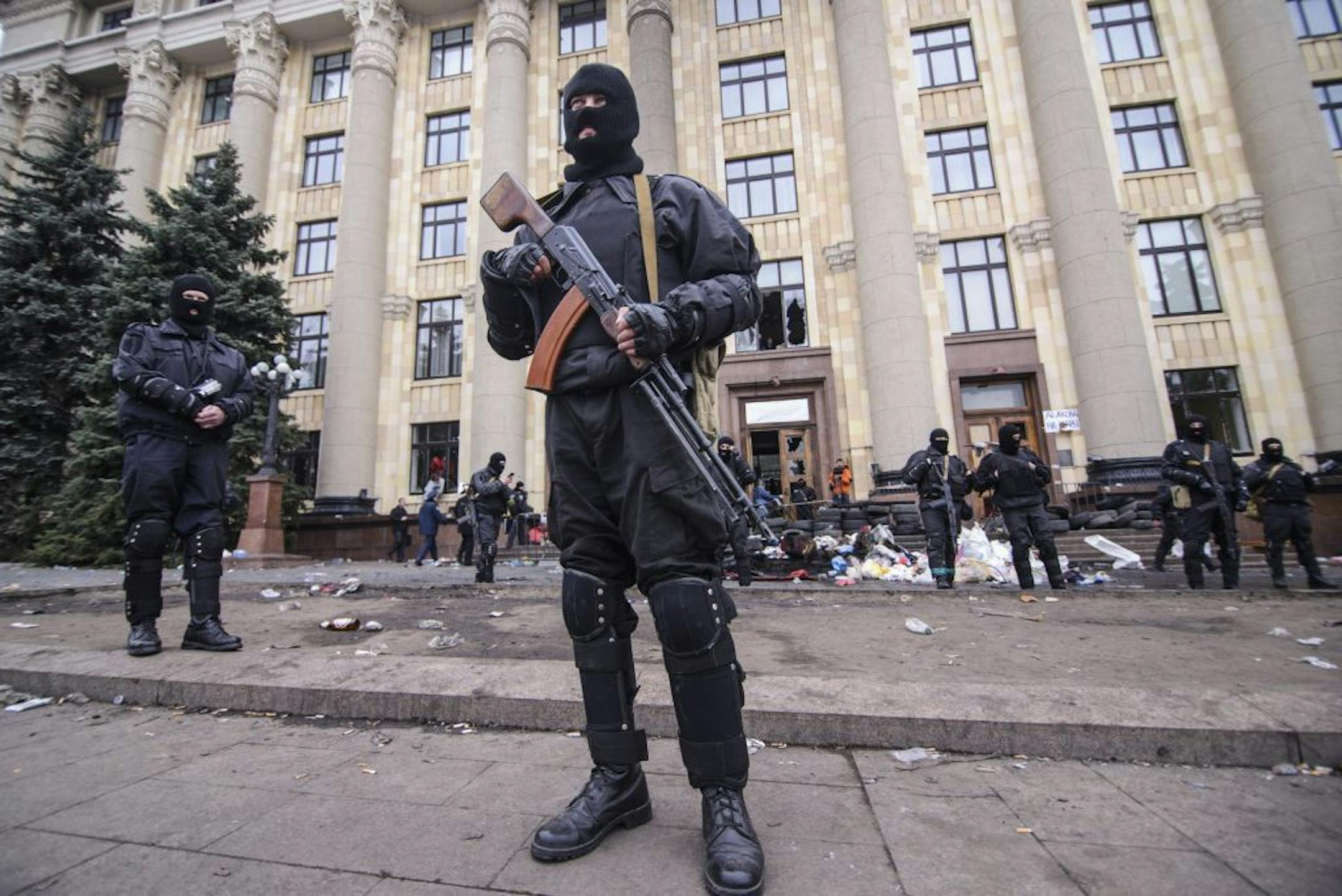 Members of a Special police unit guard the regional administration building in Kharkiv, Ukraine, Tuesday, April 8, 2014. Tuesday morning the regional administration building of Kharkiv region was completely cleared of pro-Russian separatists.