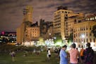 Over a dozen people gathered to play Pok�mon Go late Sunday evening near the Stone Arch Bridge in Downtown Minneapolis on July 10, 2016