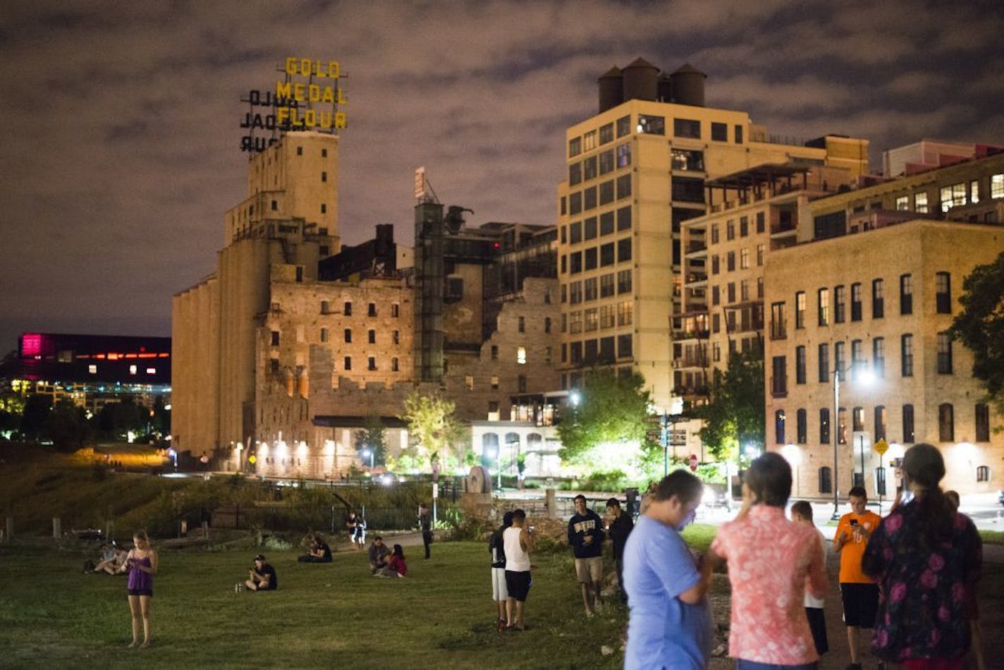 Over a dozen people gathered to play Pok�mon Go late Sunday evening near the Stone Arch Bridge in Downtown Minneapolis on July 10, 2016