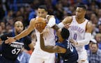 Minnesota Timberwolves guard Jeff Teague (0) is fouled by Oklahoma City Thunder guard Andre Roberson, center, during the second quarter of an NBA bask