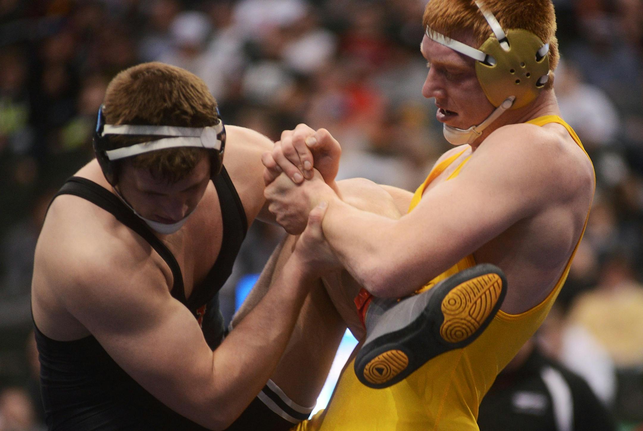 Lance Benick of Totino-Grace wrestles Carson Hagen of Worthington.] Benick won for the 2A, 195 weight class. BRIDGET BENNETT SPECIAL TO THE STAR TRIBUNE ï bridget.bennett@startibune.com wrestling individual championships Saturday evening at the Xcel Energy Center in St. Paul, MN 2A weight class 195 Lance Benick of Totino-Grace wrestles Carson Hagen of Worthington.