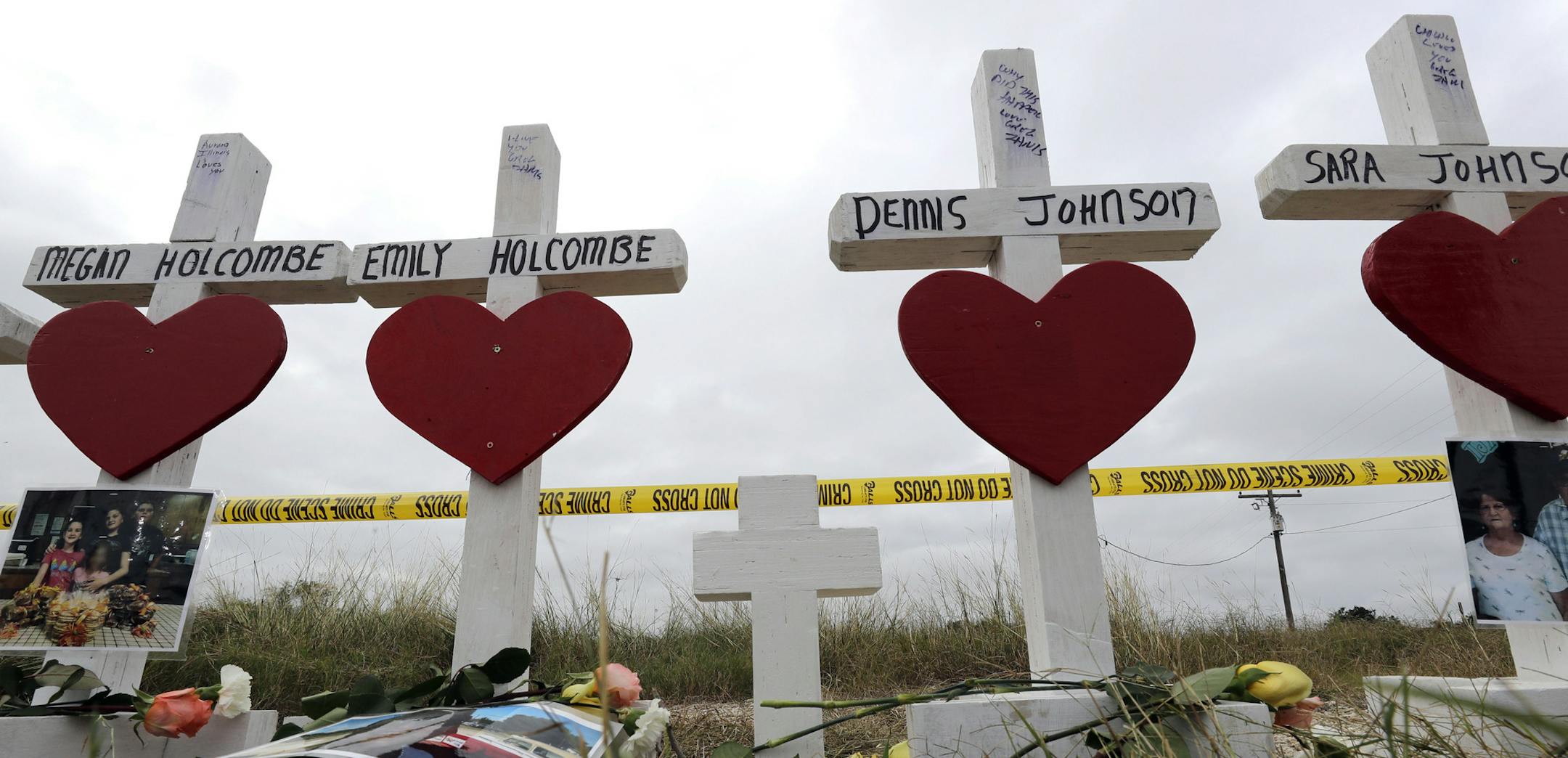 Crosses showing shooting victims names stand near the First Baptist Church Thursday, Nov. 9, 2017, in Sutherland Springs, Texas. A man opened fire inside the church in the small South Texas community on Sunday, killing more than two dozen and injuring others. (AP Photo/David J. Phillip)