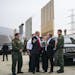 FILE-- President Donald Trump views border wall prototypes in the border neighborhood of Otay Mesa near San Diego, March 13, 2018. Trump has called fo