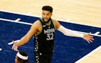 Minnesota Timberwolves center Karl-Anthony Towns (32) protests a call in the fourth quarter during an NBA basketball game against the Houston Rockets,
