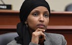File- This March 12, 2019, file photo shows Rep. Ilhan Omar, D-Minn., listening as Office of Management and Budget Acting Director Russell Vought test