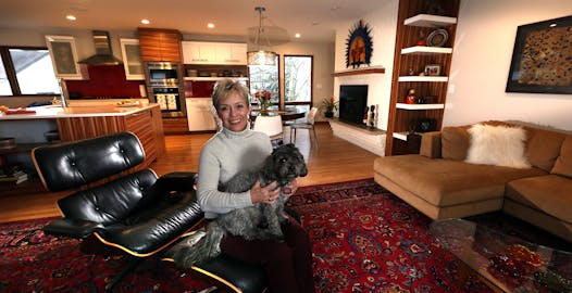 The refreshed and redesigned interiors, including zebrawood cabinet doors and accents, are “bright, open and comfortable,” said homeowner Dorene Wernke, with Costello.