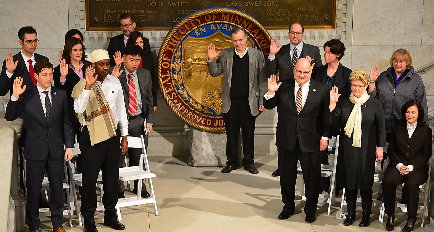 Seven brand-new City Council members and six existing ones were sworn in Monday morning at City Hall along with Betsy Hodges the New Mayor of Minneapolis. The ceremony happened in a packed City Hall rotunda.