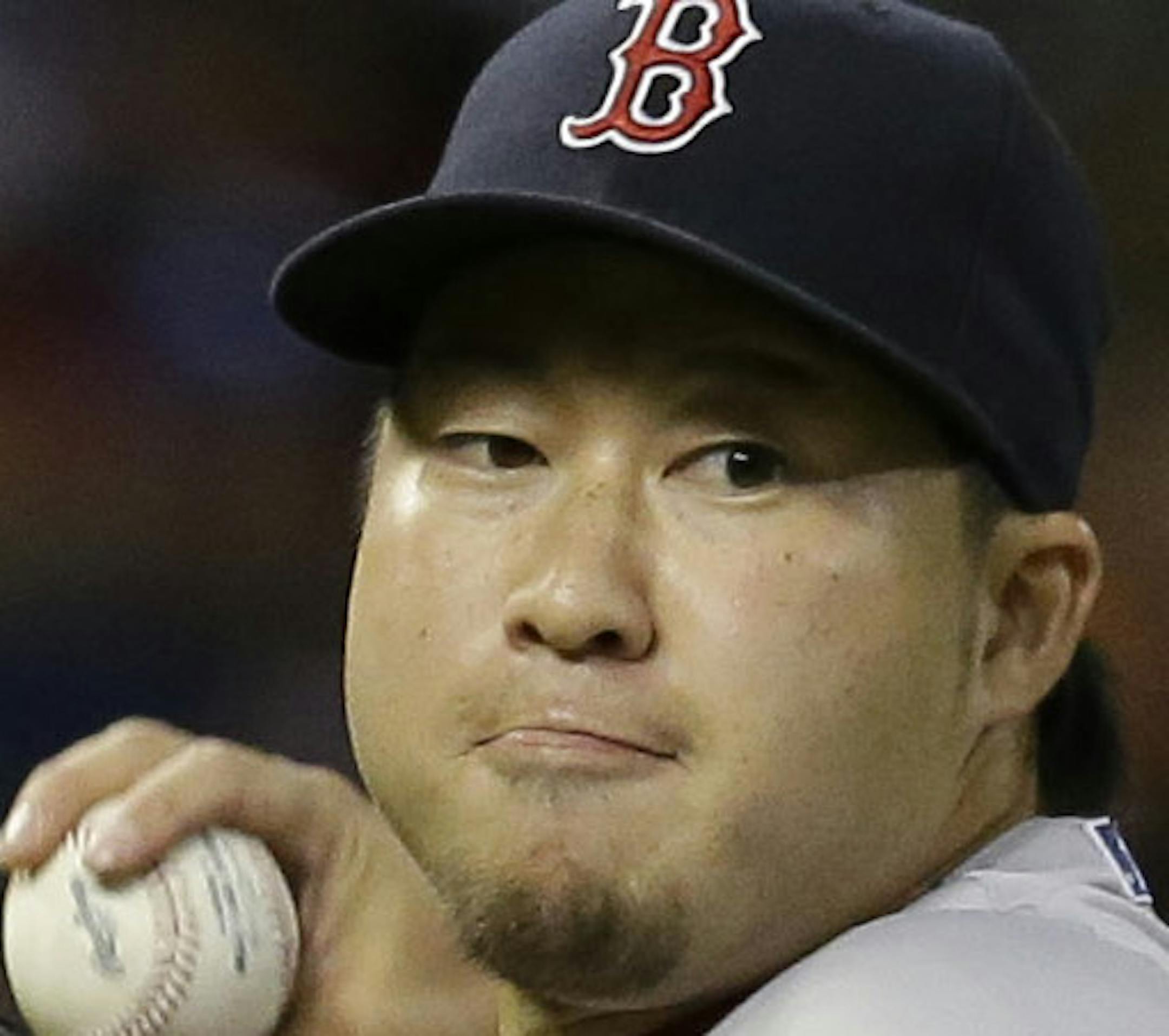 Boston Red Sox's Junichi Tazawa throws to first base against the Houston Astros in a baseball game Thursday, July 23, 2015, in Houston. (AP Photo/Pat Sullivan) ORG XMIT: OTK