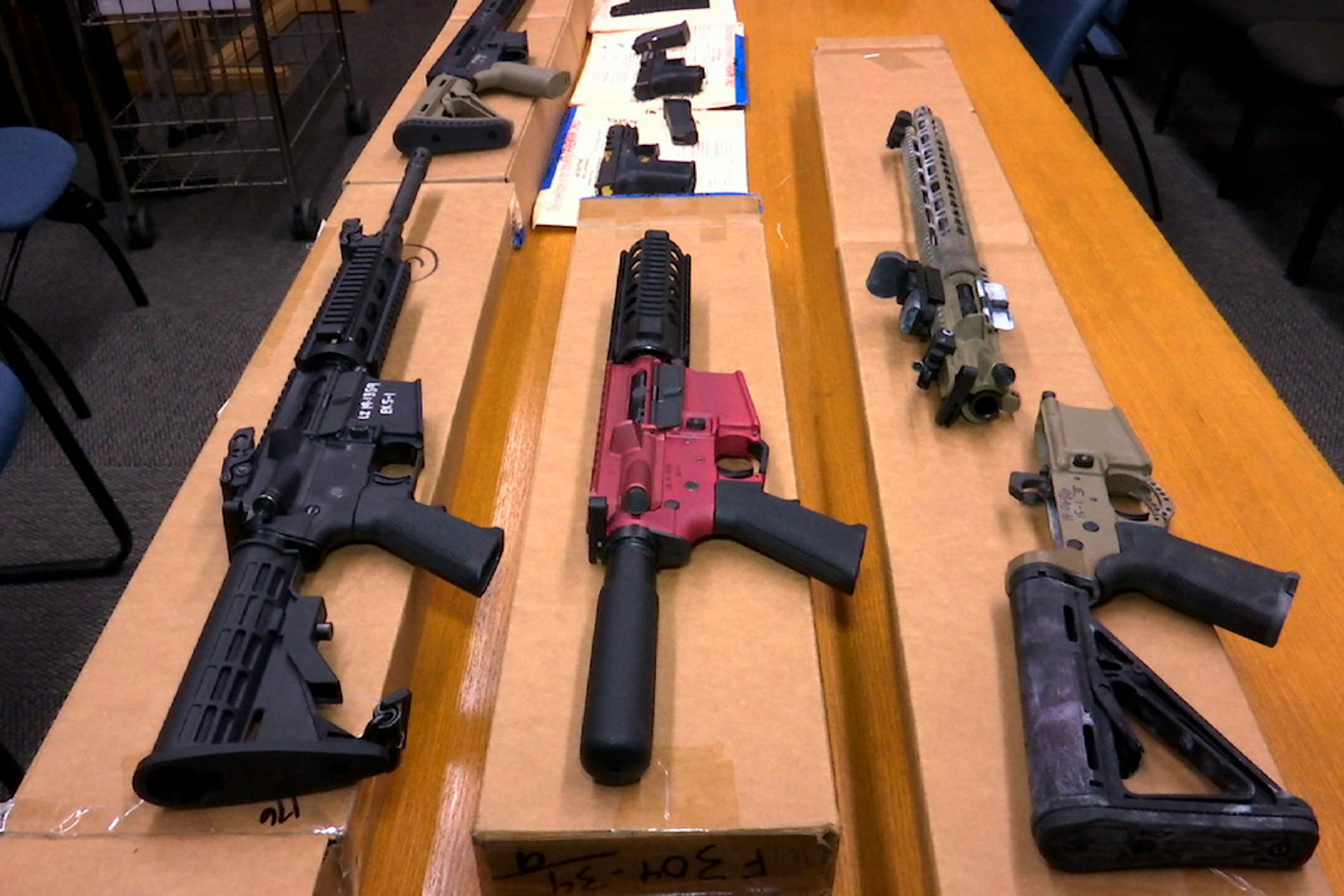 Guns on a table.