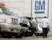 A customer looks at vehicles at a General Motors dealership.