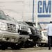 A customer looks at vehicles at a General Motors dealership.