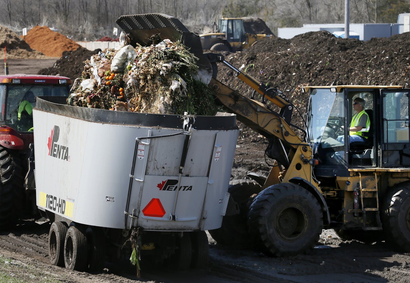 A decade after Hennepin County began pilot programs to build organics recyling among residents, just 11 cities in the county offer those programs. The number is expected to reach an even dozen next week, when the St. Louis Park City Council votes on a plan to start organics recycling this fall. Here, food waste is added to a hopper for mixing with yard waste at Organics Recycling Development in Rosemount.] BRIAN PETERSON &#x201a;&#xc4;&#xa2; brianp@startribune.com Rosemount, MN - 05/07/2013