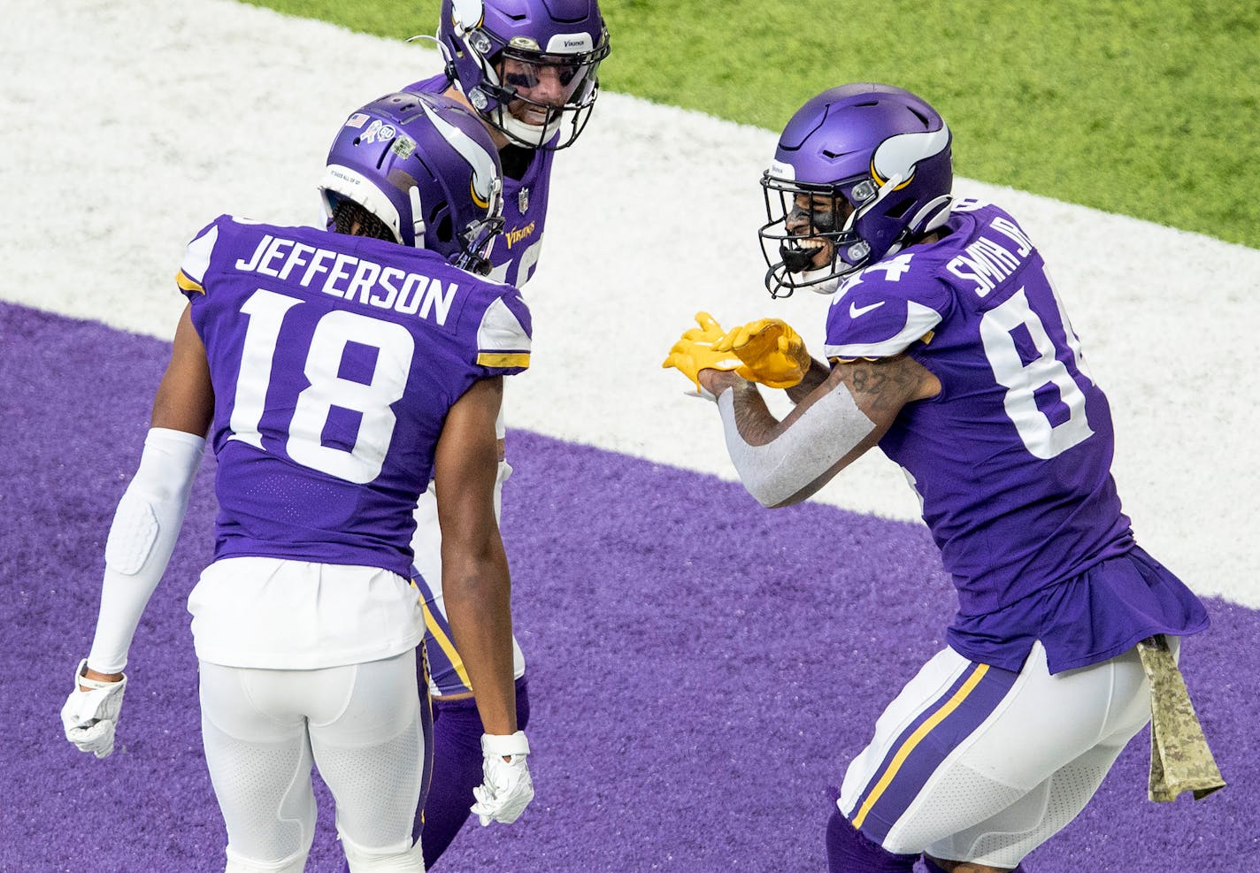 The Minnesota Vikings played the Detroit Lions at U.S. Bank Stadium in Minneapolis on Sunday, November 8, 2020. Vikings tight end Irv Smith Jr. (84) celebrated with teammates Justin Jefferson (18) and Adam Thielen (19) after scoring a touchdown in the third quarter. (Carlos Gonzalez/Minneapolis Star Tribune/TNS) ORG XMIT: 1821255