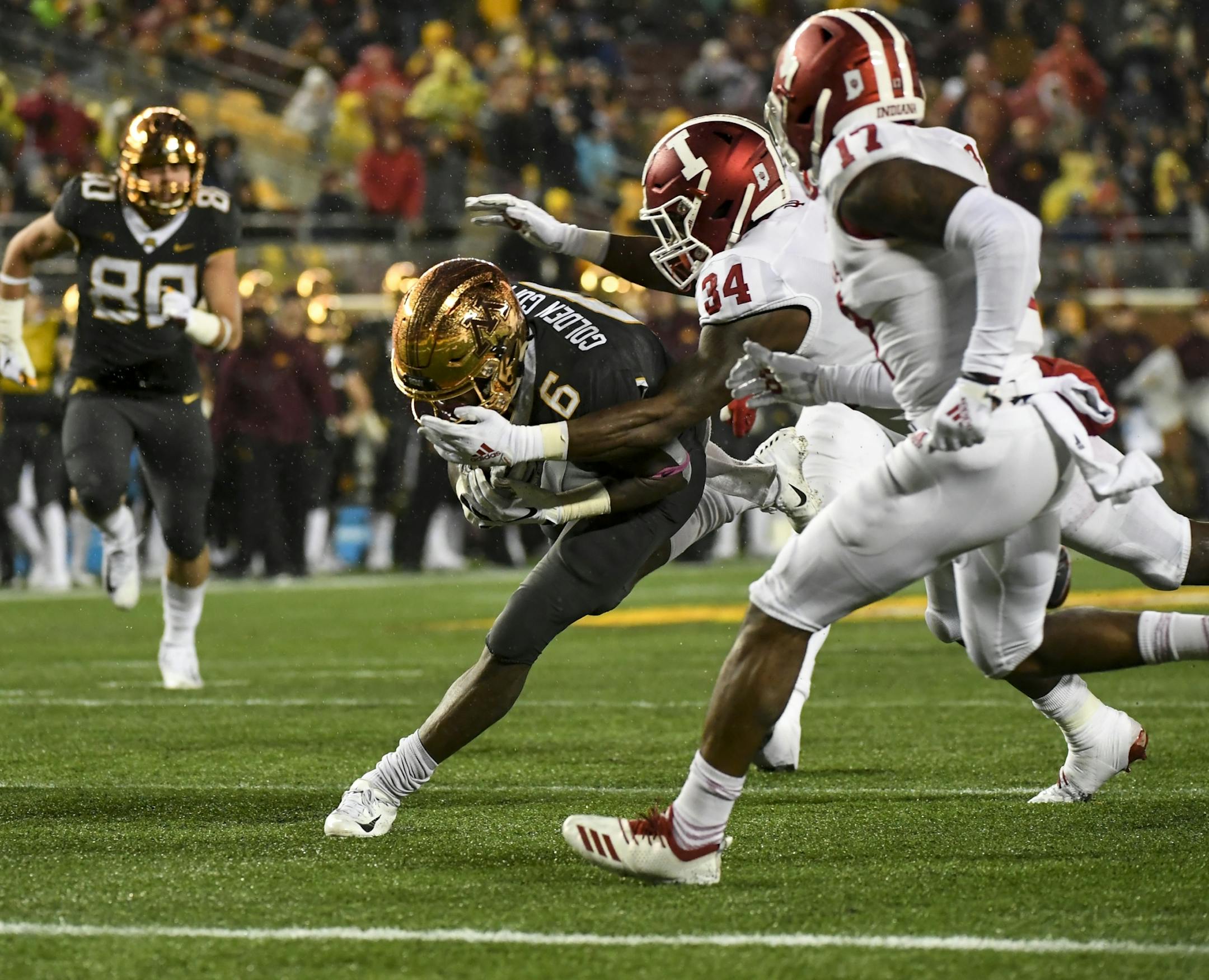 Gophers wide receiver Tyler Johnson (6) fell into the end zone for his second touchdown of the night against the Indiana Hoosiers.
