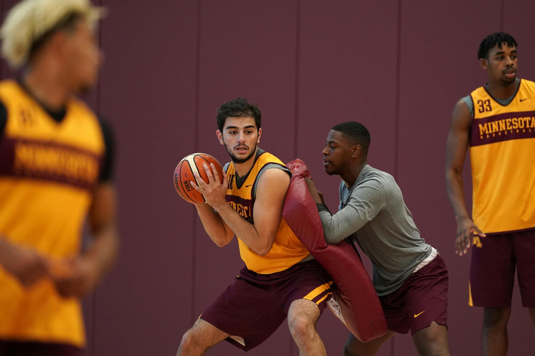 Gophers forward Alihan Demir (30) drove to the basket during Thursday's practice.
