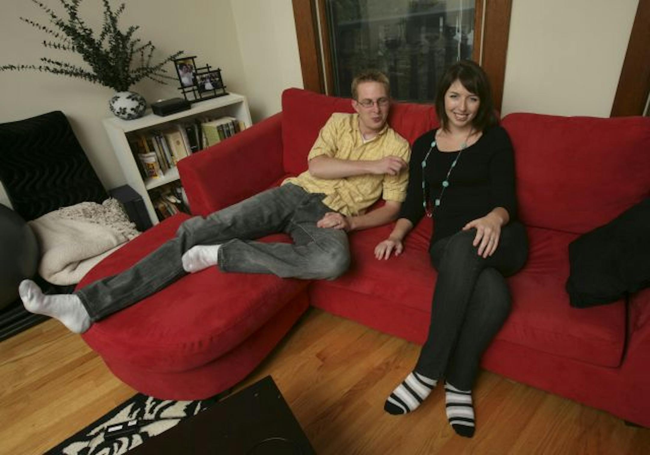 Andy Doran and Meghan Seawell, shown in their St. Paul apartment, represent "the new renters," people who could buy a home but are opting not to.