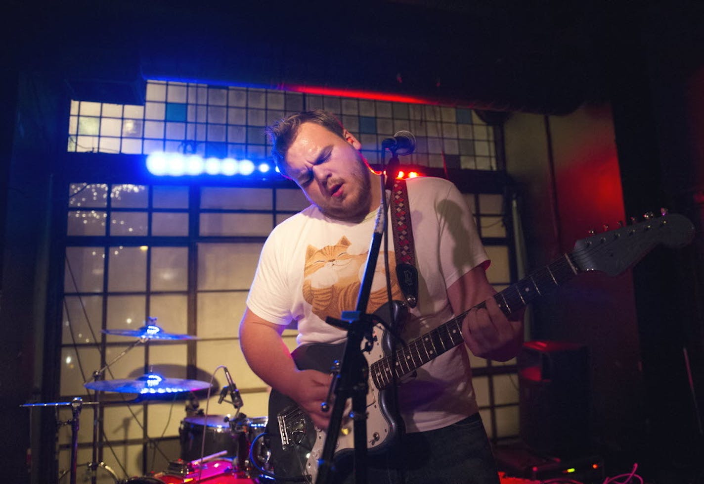 Fury Things singer/guitarist Kyle Werstein performs this past winter at Cause, where the stage backed up to the window and car lights and sirens rolled by behind bands.