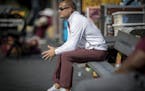 Minnesota's Head Coach P. J. Fleck sat on the bench and watched the kickers before the Gophers took on Purdue at Ross&#xf1;Ade Stadium, Saturday, Octo