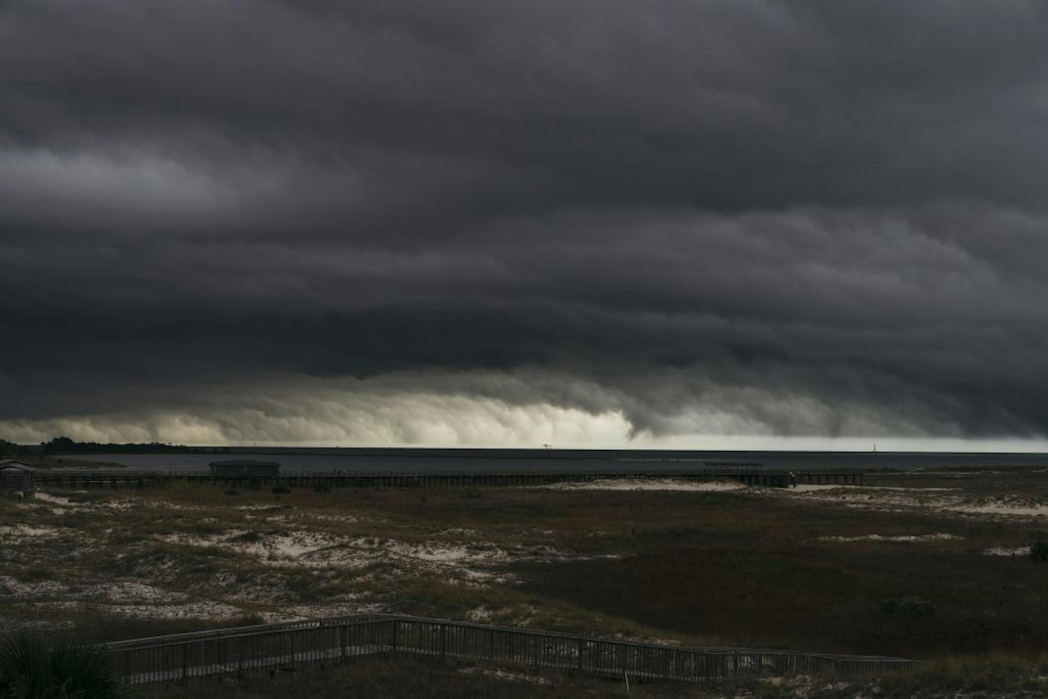 A storm rolling in over Dauphin Island, Ala., Dec. 10, 2019. Before a 60,000-year-old submerged forest disappears, scientists recently raced to search for shipworms and other sea life that might conceal medicine of the future.