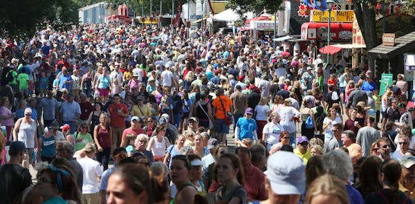 Thousands of fairgoers pack the fairground at the Minnesota State Fair, Monday, Aug. 25, 2014 in Falcon Heights, Minn. (AP Photo/Jim Mone)