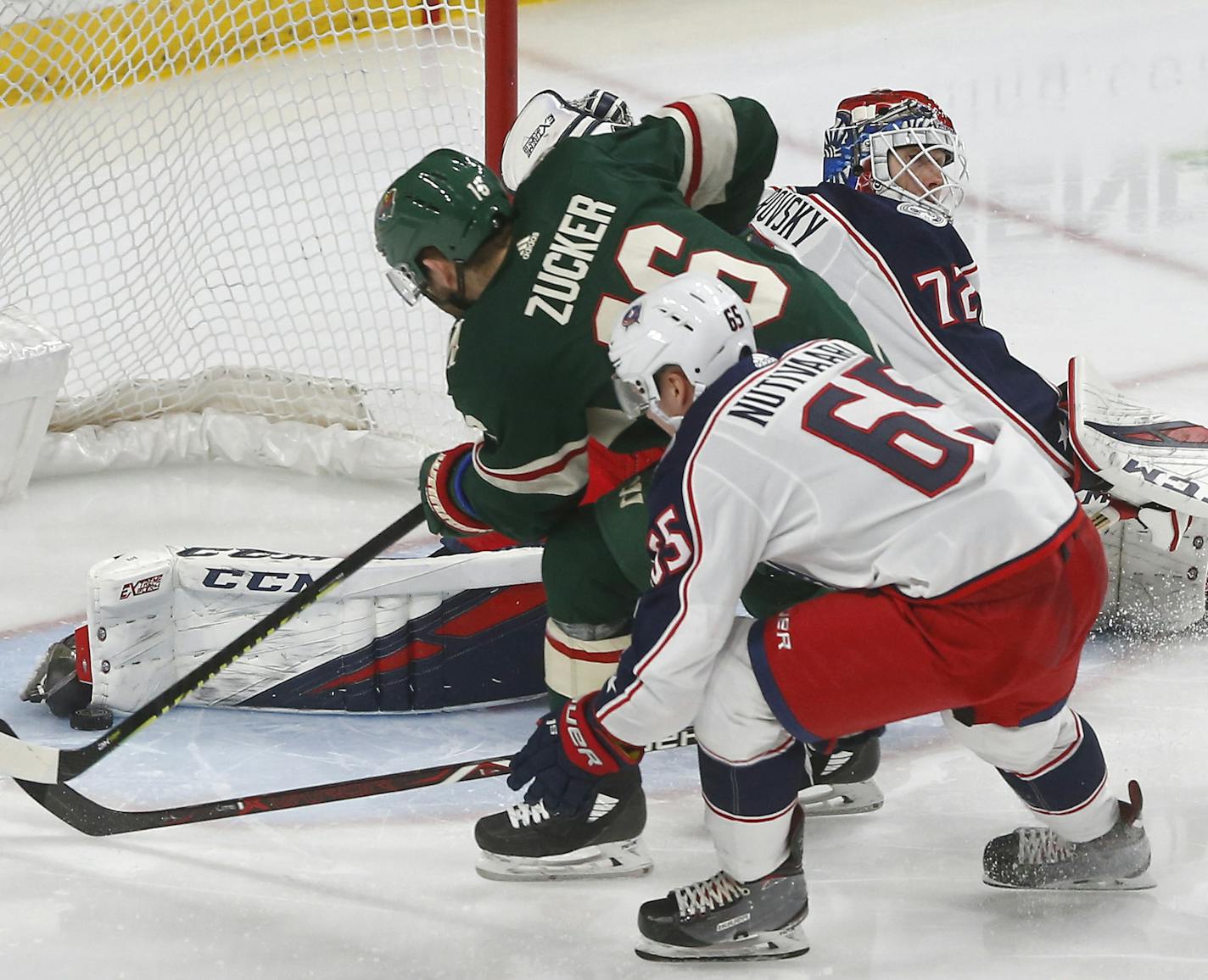 The leg pad of Columbus Blue Jackets goalie Sergei Bobrovsky stops a shot by Minnesota Wild's Jason Zucker during the third period of an NHL hockey game Saturday, Jan. 19, 2019, in St. Paul, Minn. The Wild won 2-1. (AP Photo/Jim Mone)