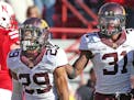 Gophers cornerbacks Briean Boddy-Calhoun (29) and Eric Murray (31) celebrated during last year's victory at Nebraska. The two seniors on Tuesday were 