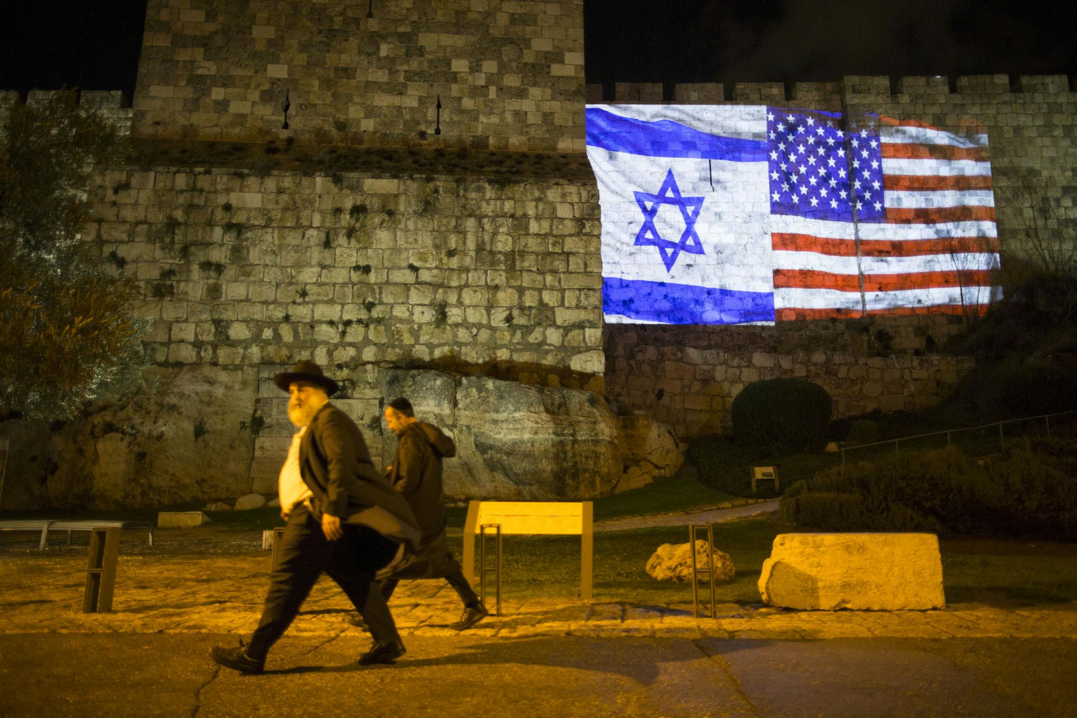 The Israeli and American flags are projected on the wall of the Old City of Jerusalem, Dec. 6, 2017. During a speech in Washington on Wednesday, President Donald Trump upended nearly seven decades of American policy by recognizing Jerusalem as the capital of Israel. (Uriel Sinai/The New York Times)