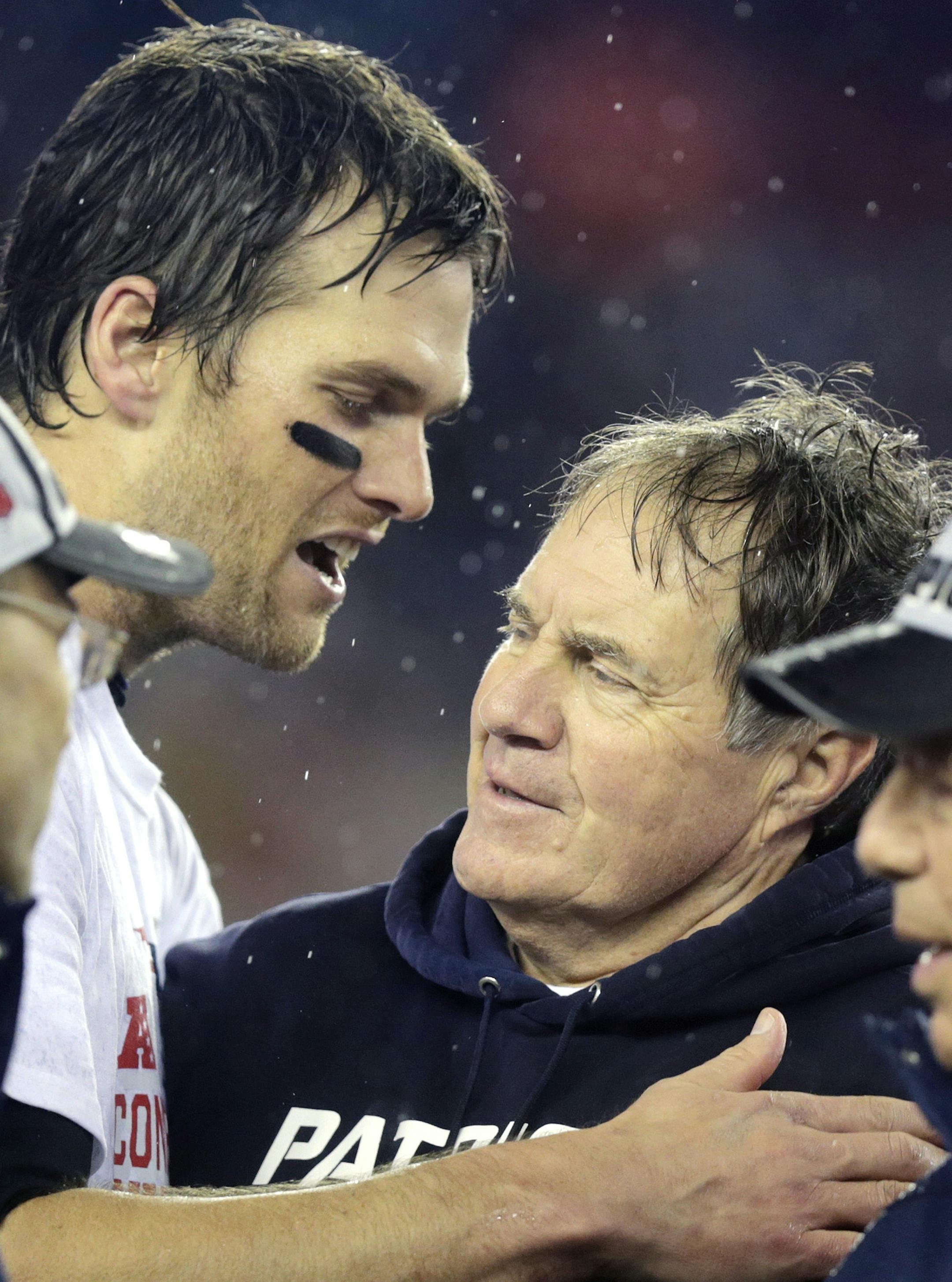 New England Patriots quarterback Tom Brady, left, speaks with Bill Belichick after the NFL football AFC Championship game Sunday, Jan. 18, 2015, in Foxborough, Mass. The Patriots defeated the Colts 45-7 to advance to the Super Bowl against the Seattle Seahawks. (AP Photo/Charles Krupa) ORG XMIT: FBO252