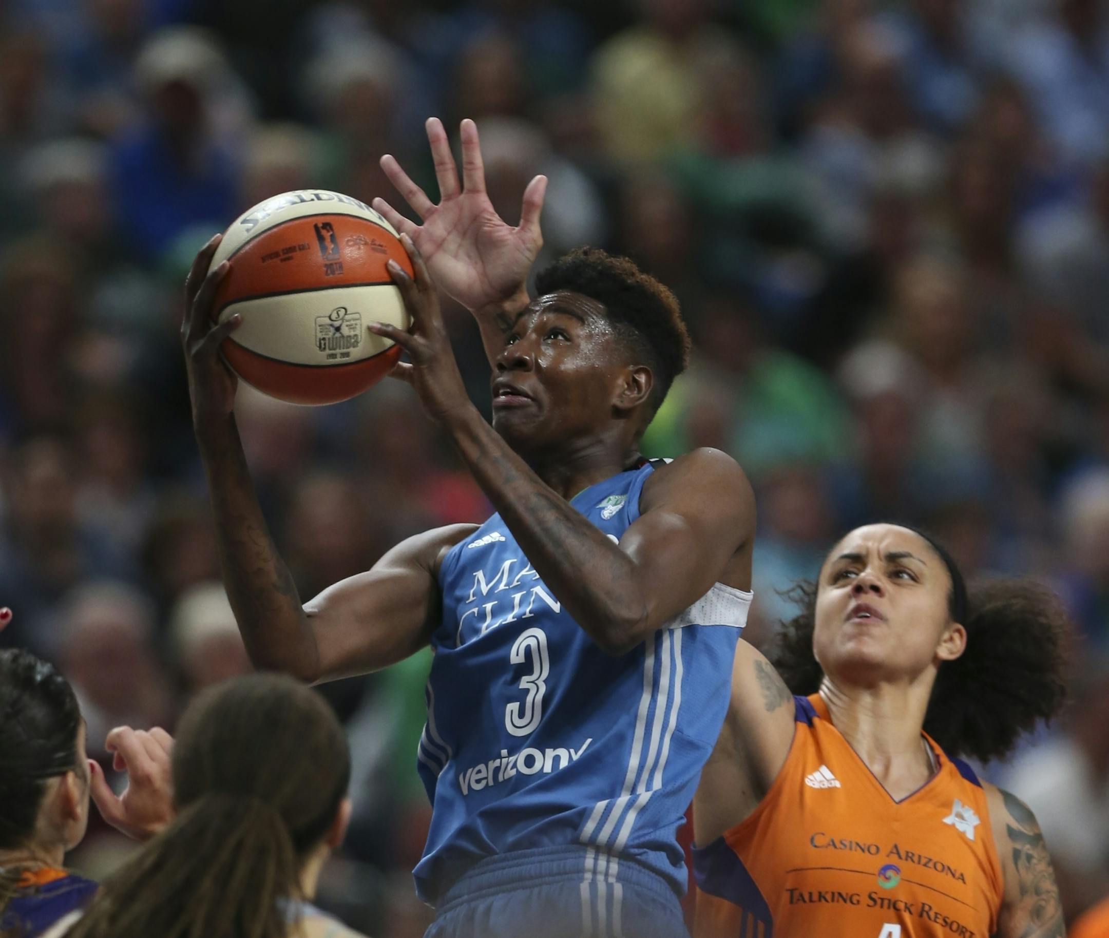 Minnesota Lynx forward Natasha Howard (3) put up a third quarter shot while defended by Phoenix Mercury forward Candice Dupree (4).