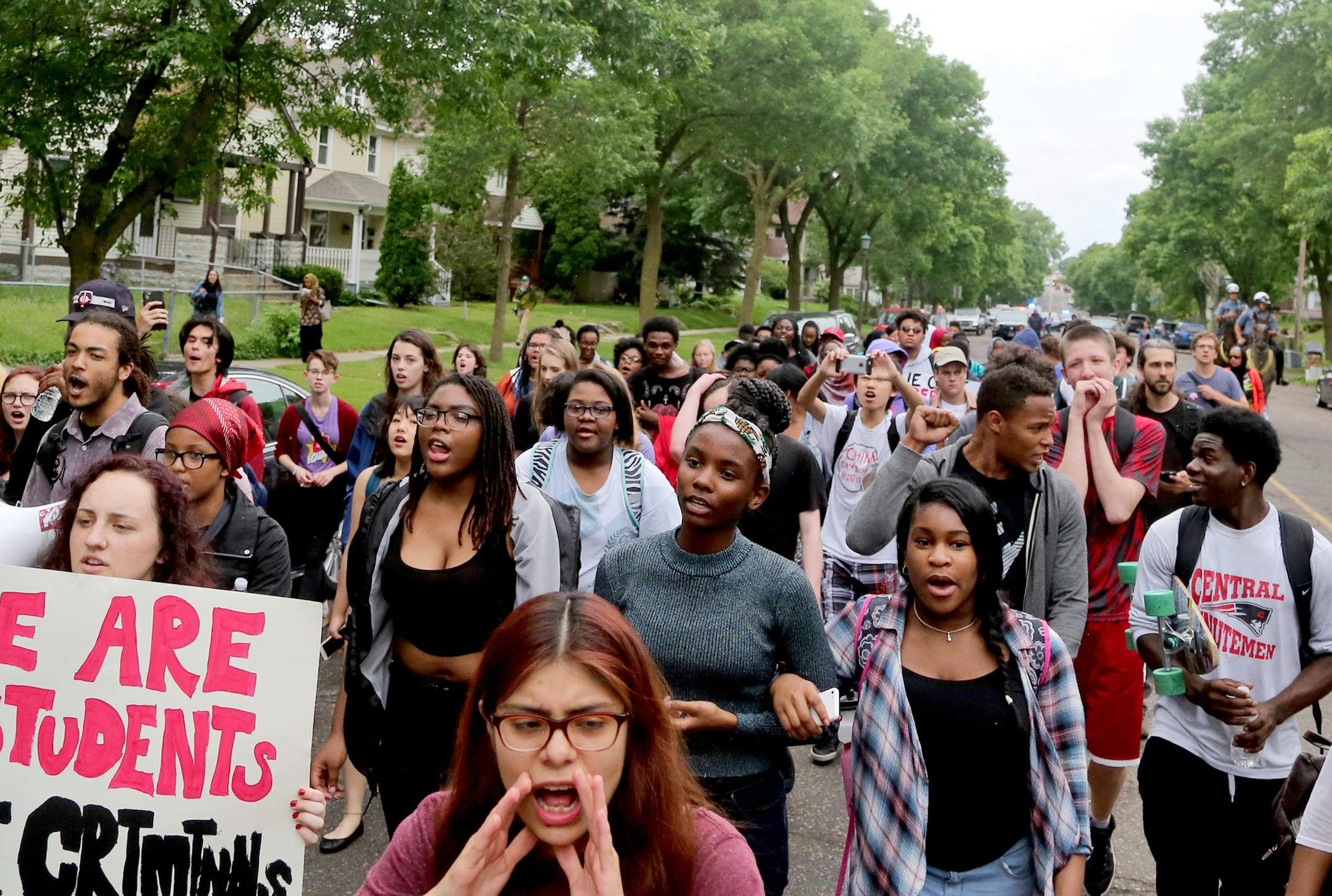 St. Paul Central High School students and some supporters march down Marshall Ave. towards City Hall Tuesday, May 31, 2016, in St. Paul, MN. The students walked out of class to protest what they believed to be a manhandling last week of a black youth by a cop assigned to the high school.](DAVID JOLES/STARTRIBUNE)djoles@startribune Students at St. Paul Central High School are walking out to protest what they perceived to be the manhandling last week of a black youth by a cop assigned to the high