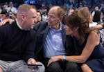 Timberwolves boss Tim Connelly speaks with owner Glen Taylor and his wife, Becky, before Game 4 of the Western Conference finals at American Airlines 