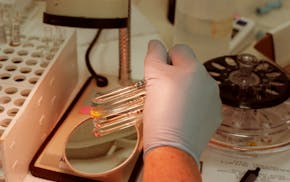 Arlene Wood, a medical lab technician at the new American Red Cross National Testing Laboratory in Eagan, tested blood types and Rh factors of various
