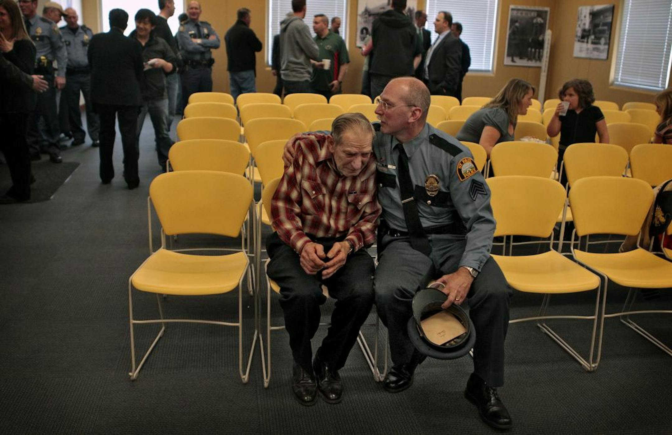 St. Paul police Sgt. Tom Bergren embraced his father, Ray, 81, after an awards ceremony Thursday where Tom Bergren received his fourth Medal of Commendation.