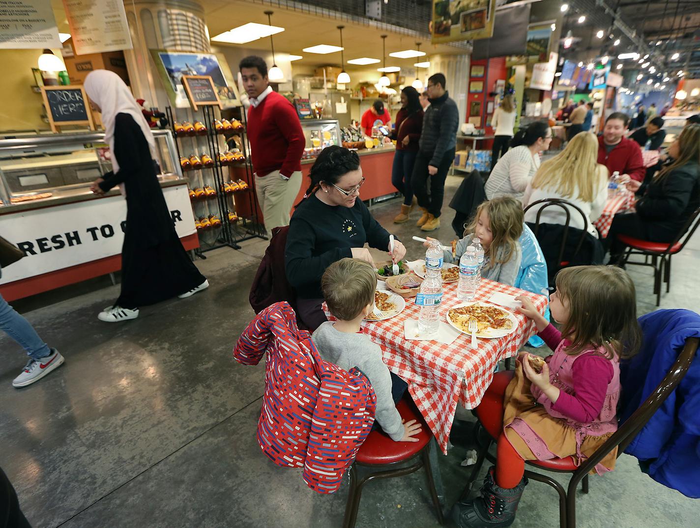 Jazzy Erickson, seated at left, had lunch with Hazel Blackstock (clockwise), Daphne Fazio and Bertie Blackstock at the Midtown Global Market.