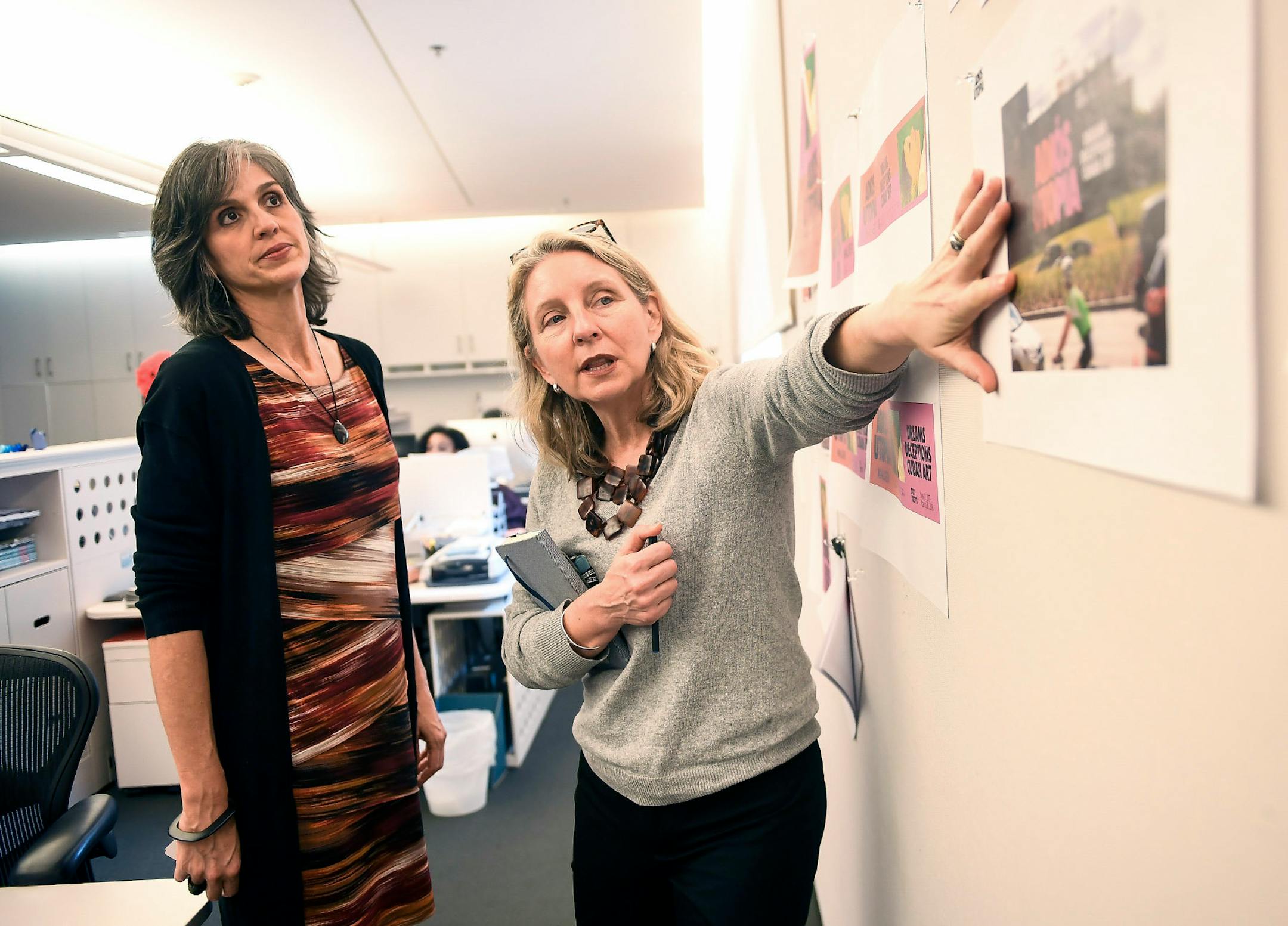 Walker Art Center executive director Olga Viso, left, listened to Annie Gillette Cleveland, chief of marketing and strategic communications for the Walker, as Cleveland discussed some of the upcoming promotional materials for the show, "Adios Utopia."