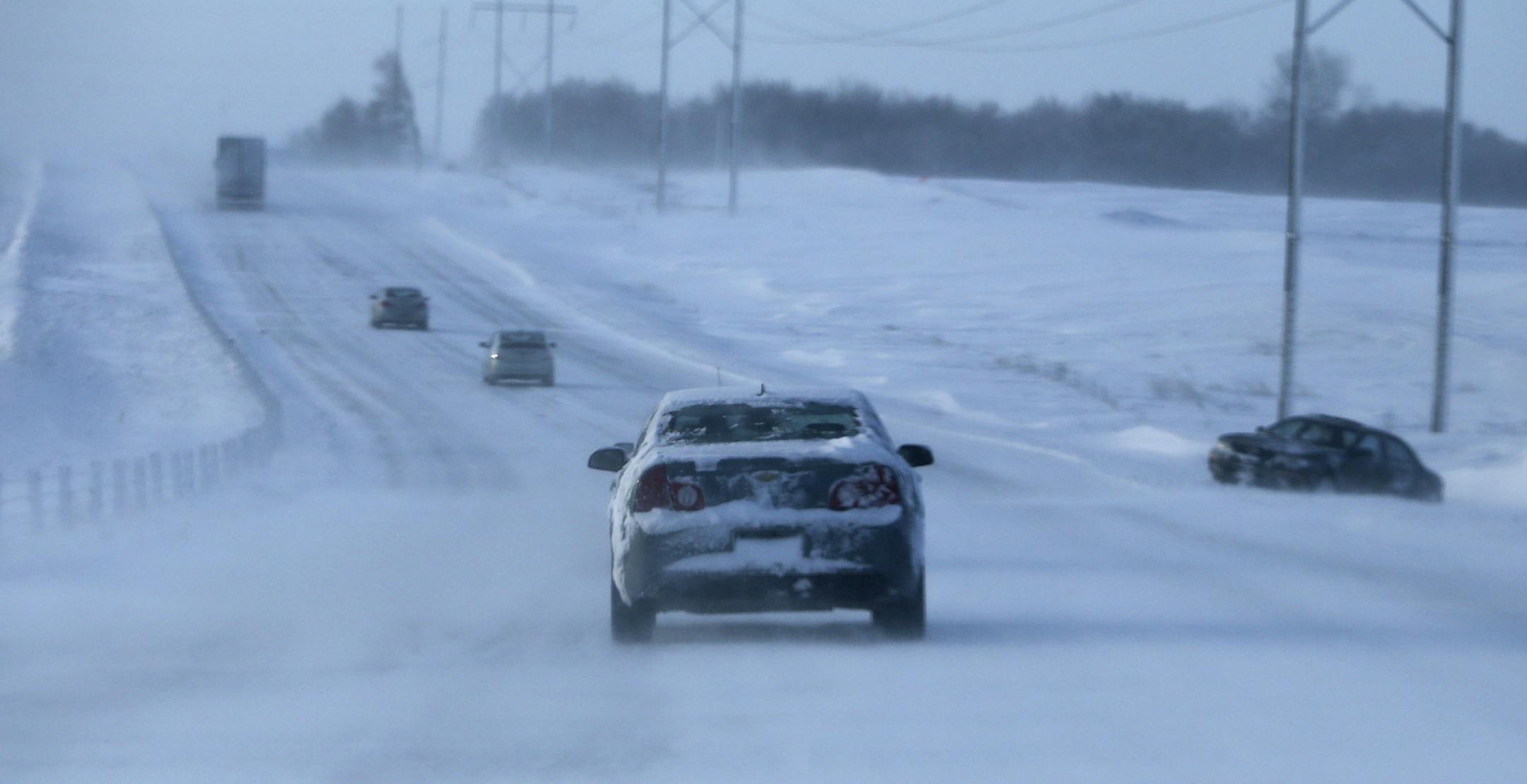 Blizzard-like conditions near Dundas on I-35, where a car went into the ditch Friday, Feb. 21, 2014. I-35 to the south at Owatonna into Iowa was closed because of blizzard conditions.