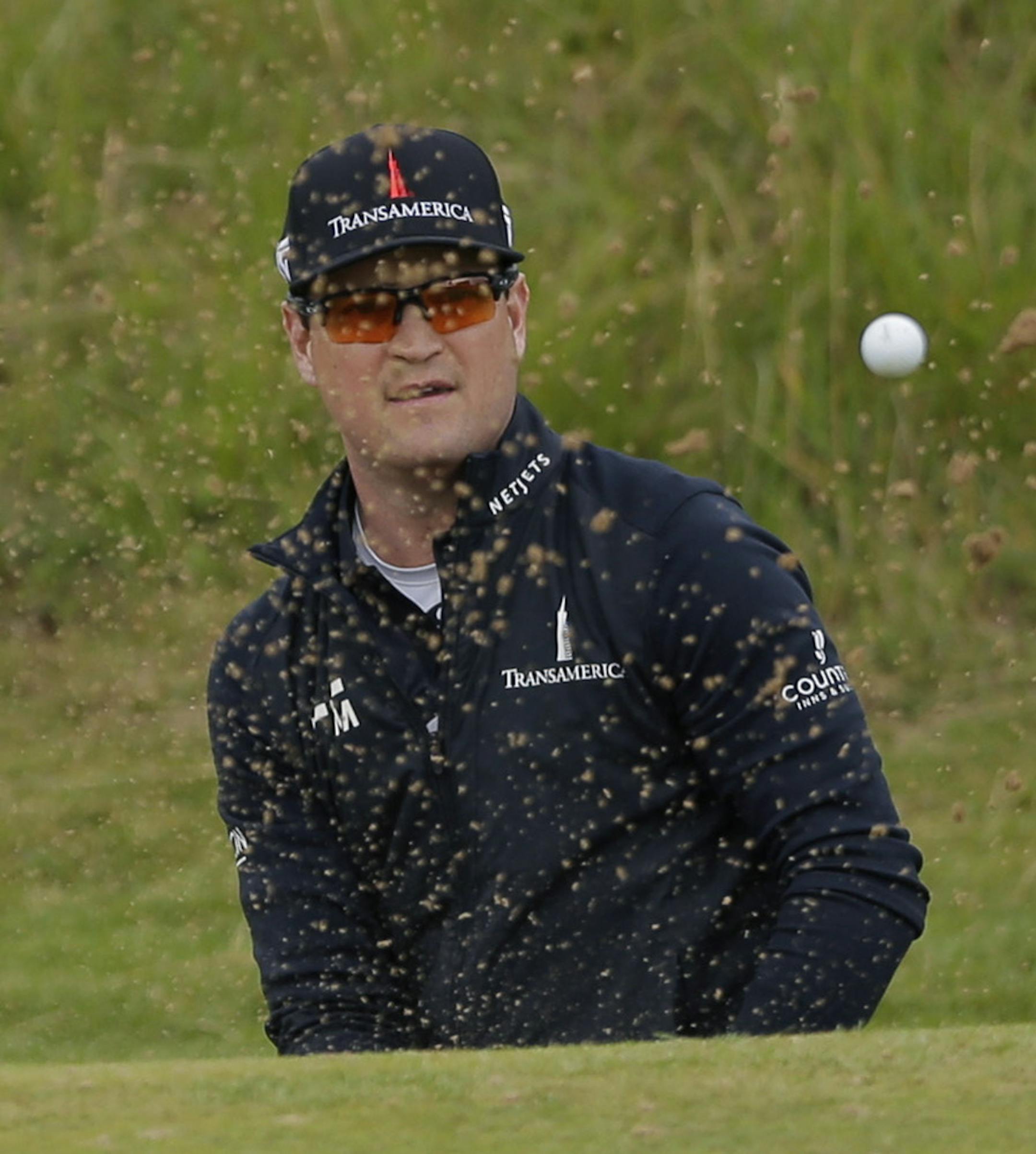 Zach Johnson of the US watches his ball after chipping out of the bunker on the 8th hole during the second round of the British Open Golf Championship, at Royal Birkdale, Southport, England, FridayJuly 21, 2017. (AP Photo/Alastair Grant)