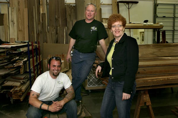 Jon Buck (left), and Rick and Cindy Siewert are partners in Wood From the Hood.
