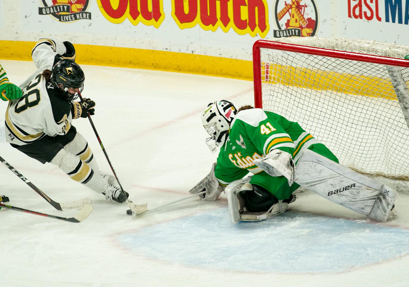 Andover forward Tyra Turner (28) was stopped by Edina goalkeeper Uma Corniea (41) in the second period. ]