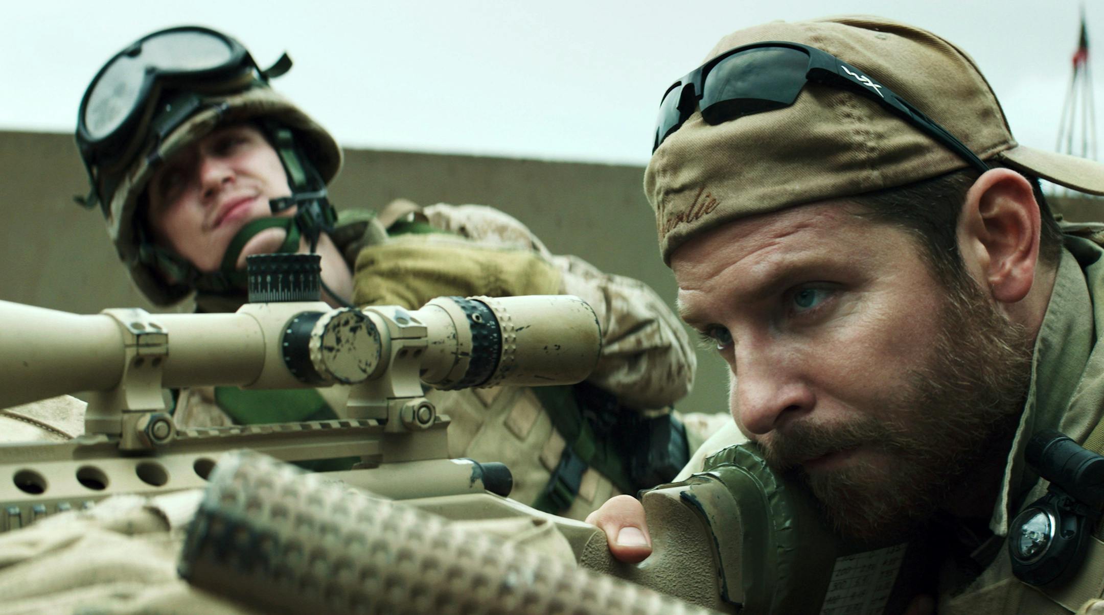 In this image released by Warner Bros. Pictures, Kyle Gallner, left, and Bradley Cooper appear in a scene from "American Sniper." The film is based on the autobiography by Chris Kyle. (AP Photo/Warner Bros. Pictures) ORG XMIT: MIN2015012112001535