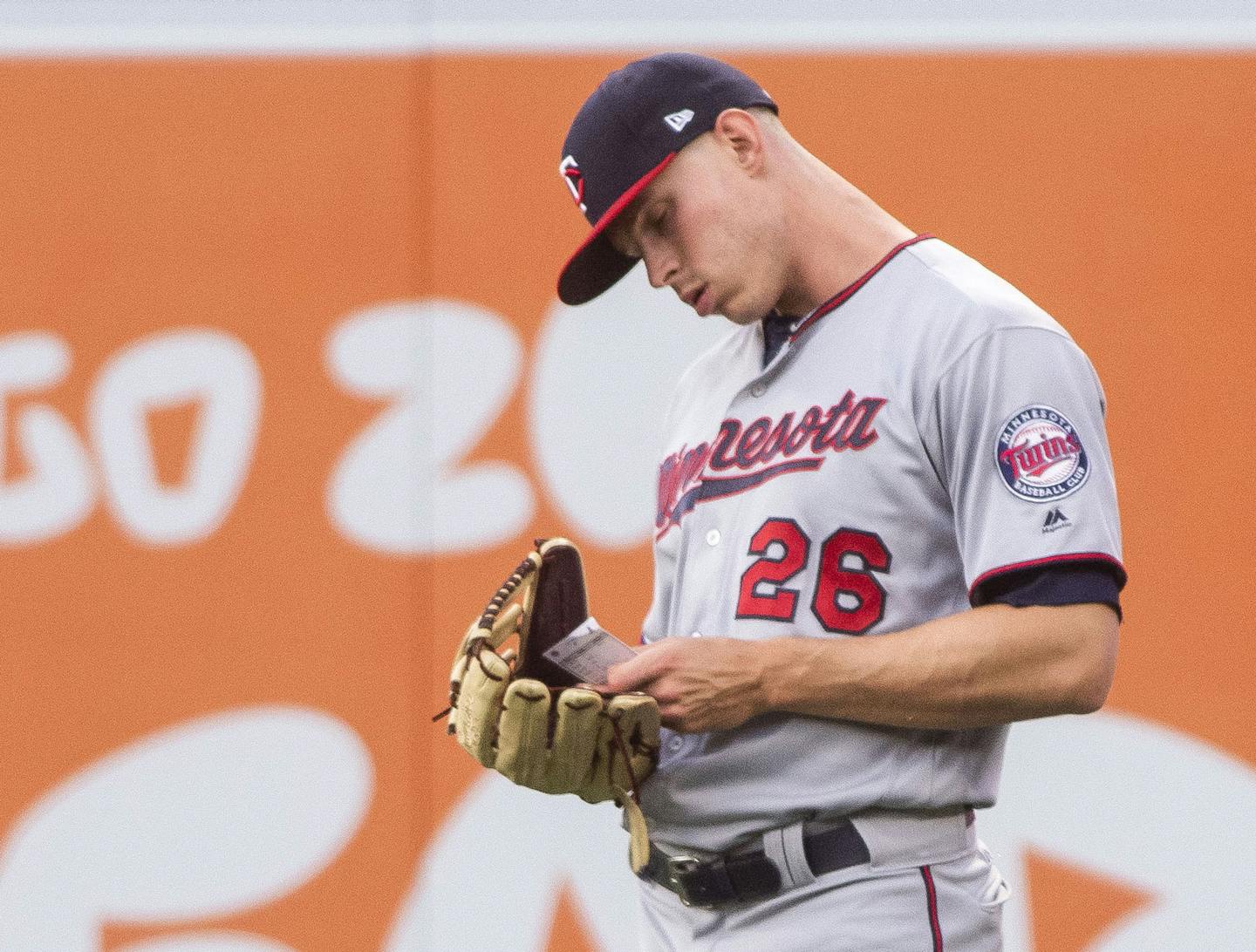 Twins right fielder Max Kepler checked his positioning card Thursday in Anaheim. "It's nice to know that … this is where you're supposed to be," outfielder Ryan LaMarre said of the data-driven positioning cards.