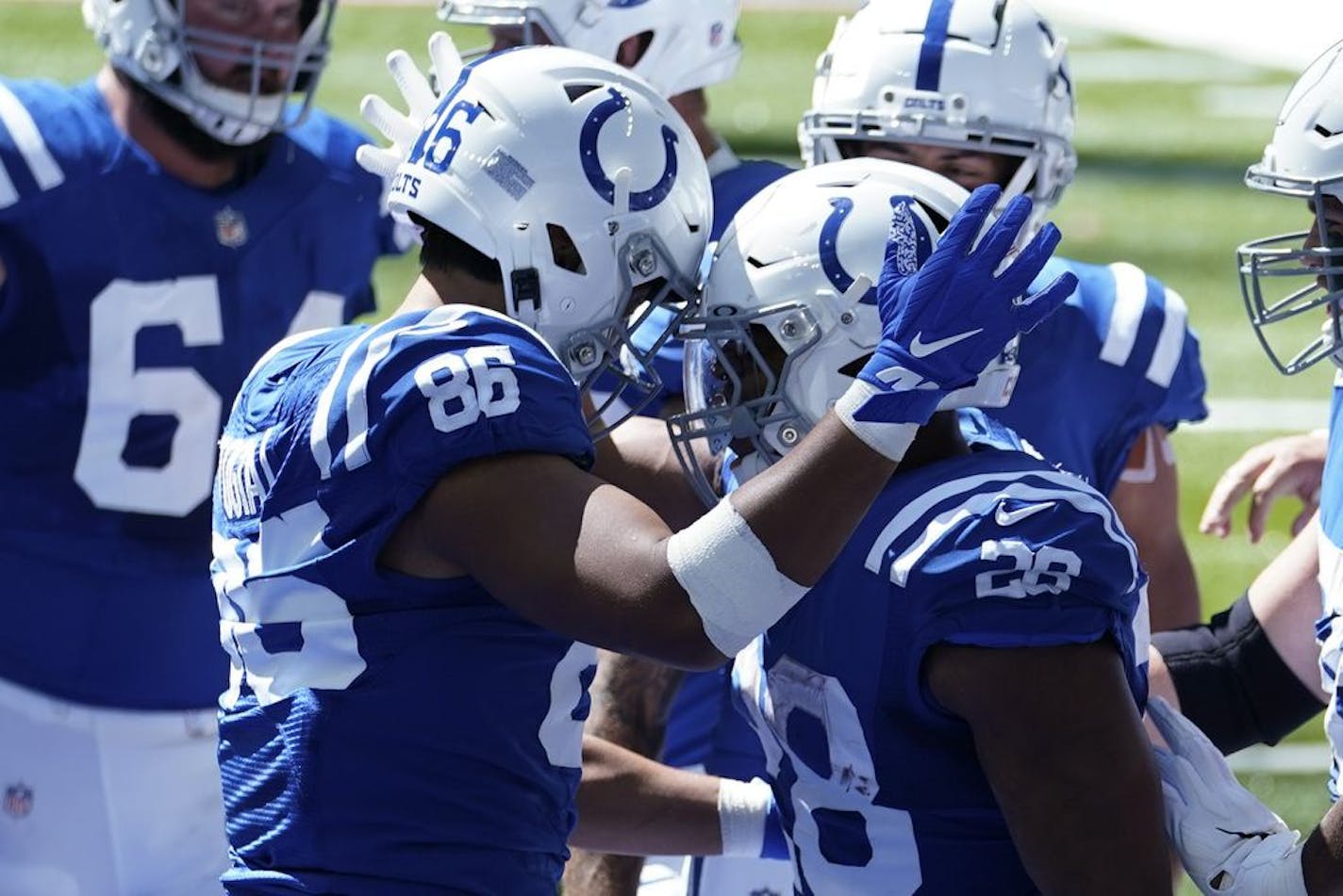 Indianapolis Colts' Jonathan Taylor (28) celebrates with Noah Togiai (86) after running for a touchdown during the first half of an NFL football game against the Minnesota Vikings, Sunday, Sept. 20, 2020, in Indianapolis.