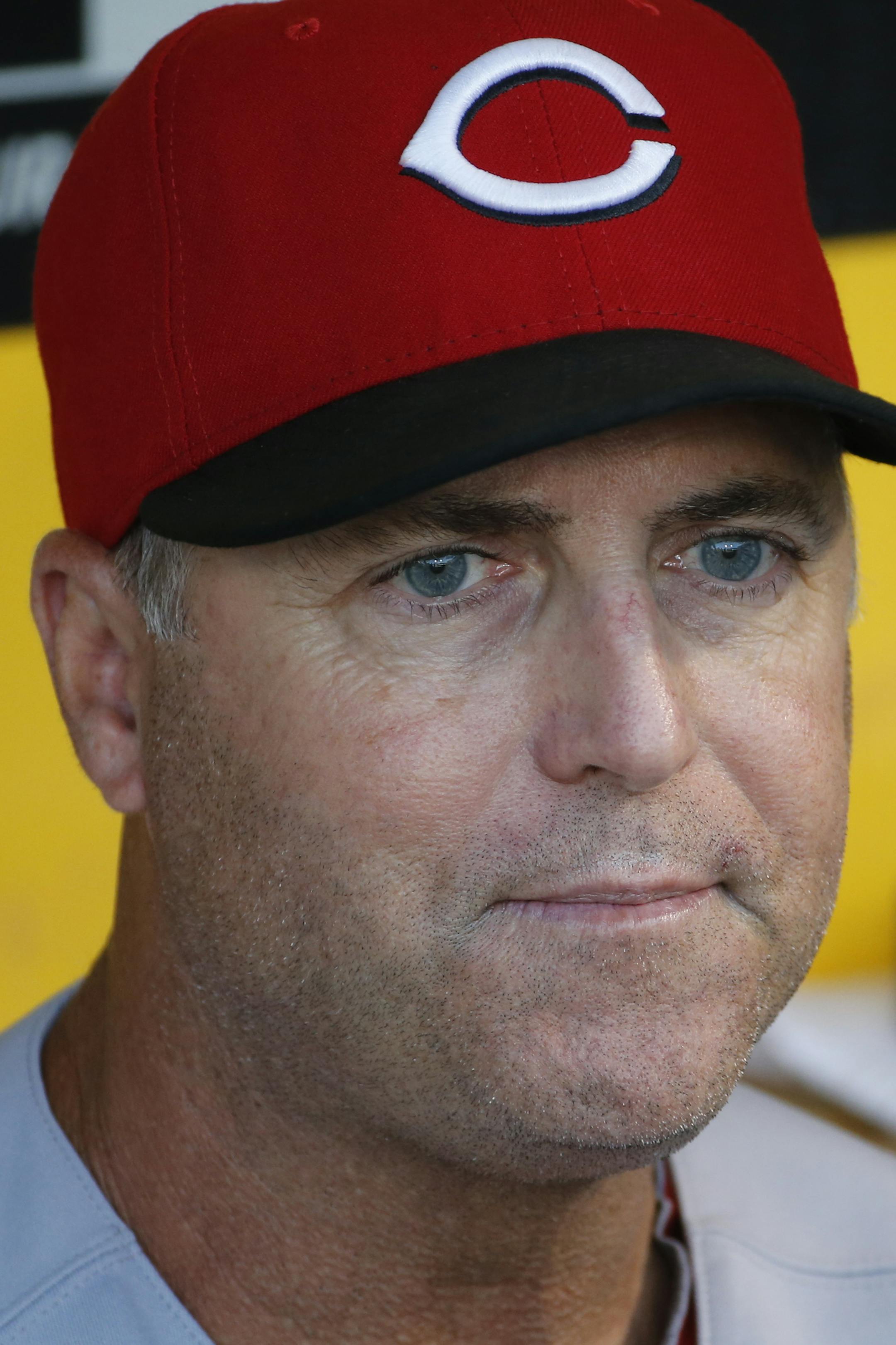 Cincinnati Reds manager Bryan Price sits in the dugout before a baseball game against the Pittsburgh Pirates in Pittsburgh Friday, Aug. 29, 2014. (AP Photo/Gene J. Puskar) ORG XMIT: PAGP