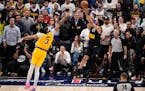 Nuggets guard Jamal Murray (27) hits the game-winning basket against Lakers forward Anthony Davis (3) at the buzzer to win Game 2.