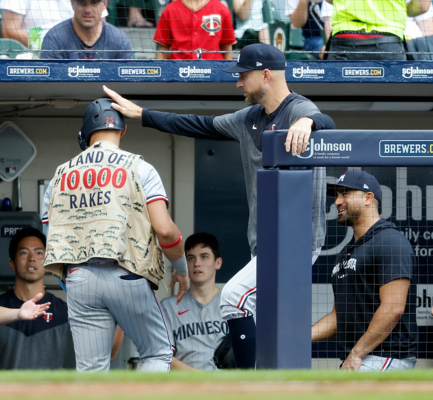 Minnesota Twins' Royce Lewis is congratulated by manager Rocco Baldelli after his two-run home run against the Milwaukee Brewers during the fthird inning of a baseball game Wednesday, Aug 23, 2023, in Milwaukee. (AP Photo/Jeffrey Phelps)