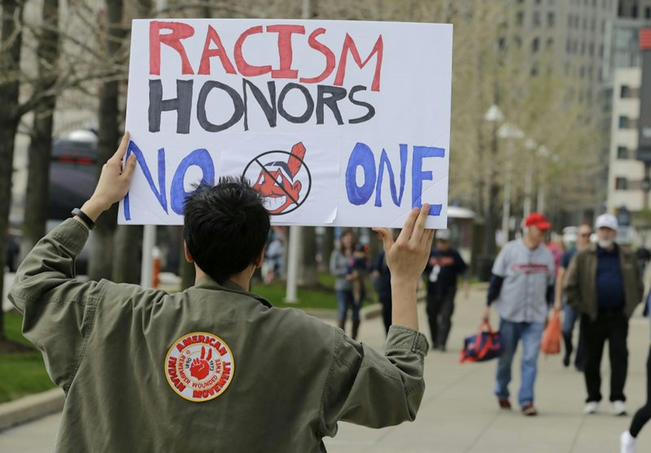Josh Hunt protests as fans walk to the ballpark before a baseball game, Tuesday between the Chicago White Sox and the Cleveland Indians, April 11, 2017, .