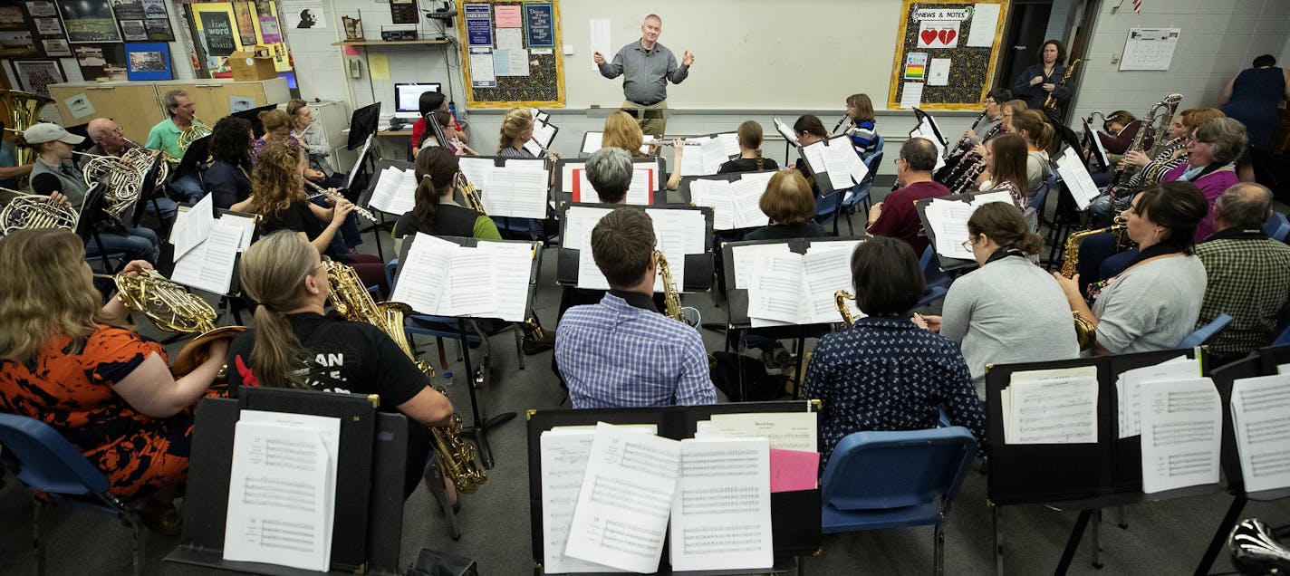 Steve Lyon and the SLP Community Band during their final rehearsal before they perform the piece he wrote about his cancer journey, "Melanomore," at the Minnesota Orchestra Hall. ] CARLOS GONZALEZ ï cgonzalez@startribune.com ñ May 1, 2018, Champlin Park, MN, Steve Lyon and his SLP Community Band will have their final rehearsal before they perform the piece he wrote about his cancer journey, "Melanomore," at the Minnesota Orchestra Hall. The rehearsal is at Champlin Park High School.