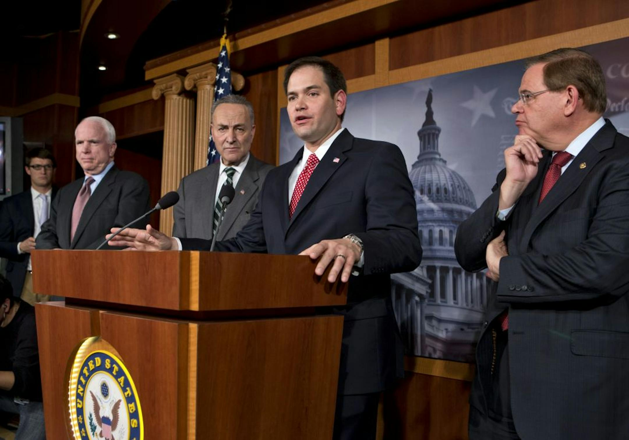 A bipartisan group of leading senators announce that they have reached agreement on the principles of sweeping legislation to rewrite the nation's immigration laws, during a news conference at the Capitol in Washington, Monday, Jan. 28, 2013. From left are Sen. John McCain, R-Ariz., Sen. Charles Schumer, D-N.Y., Sen. Marco Rubio, R-Fla., and Sen. Robert Menendez, D-N.J. The deal covers border security, guest workers and employer verification, as well as a path to citizenship for the 11 million i