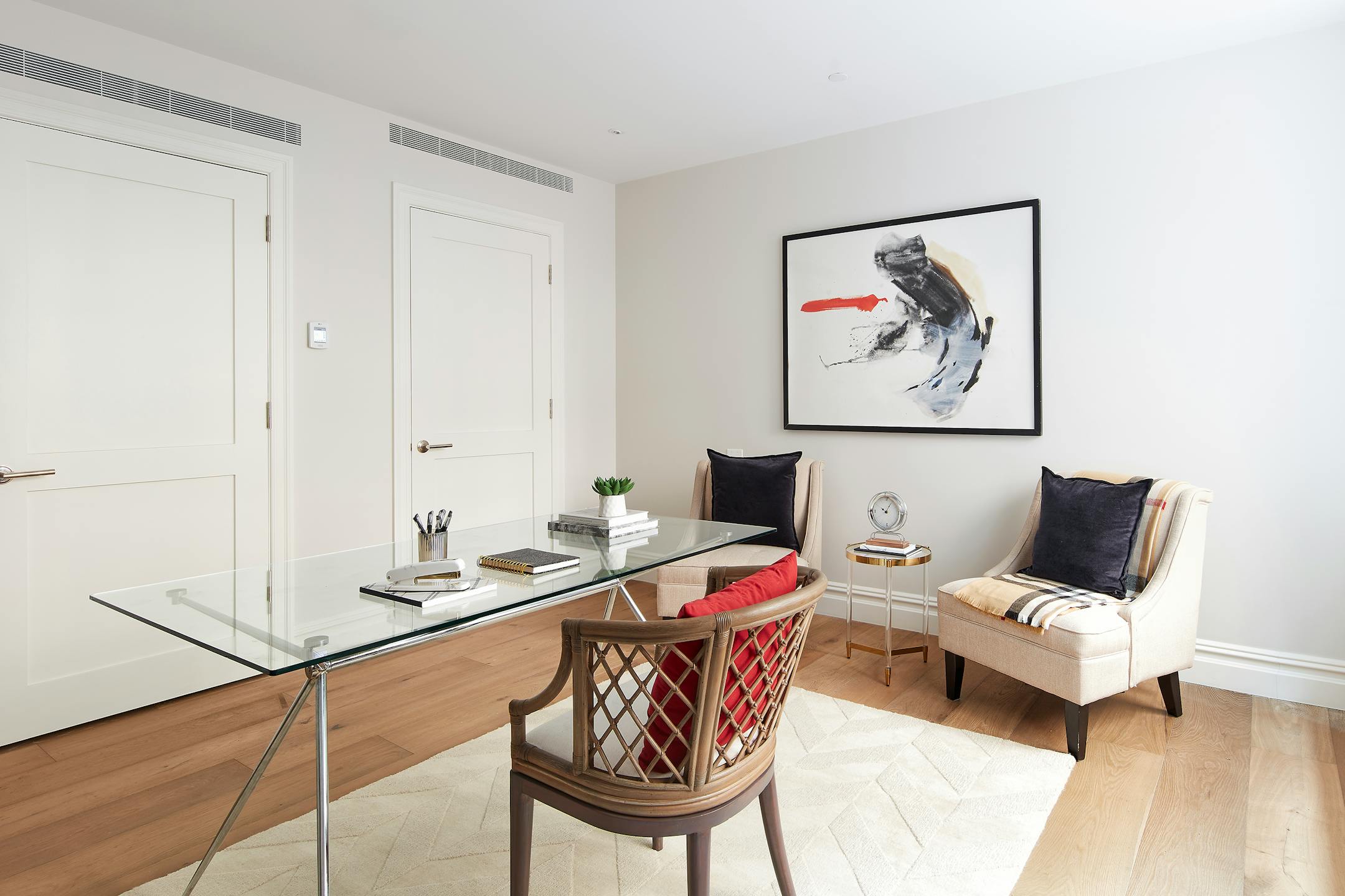 An open bright office is highlighted with classic colors to include taupe, black and red. (Scott Gabriel Morris/TNS)